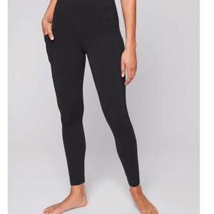 Athleta Stash Pocket Salutation Tight Leggings - Black. Size small.